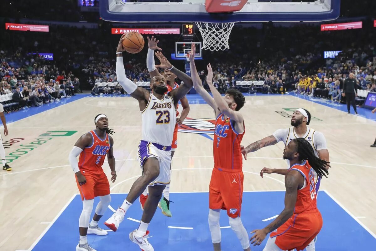 Dec 23, 2023; Oklahoma City, Oklahoma, USA; Los Angeles Lakers forward LeBron James (23) goes to the basket for a dunk against the Oklahoma City Thunder during the second half at Paycom Center. Mandatory Credit: Alonzo Adams-USA TODAY Sports