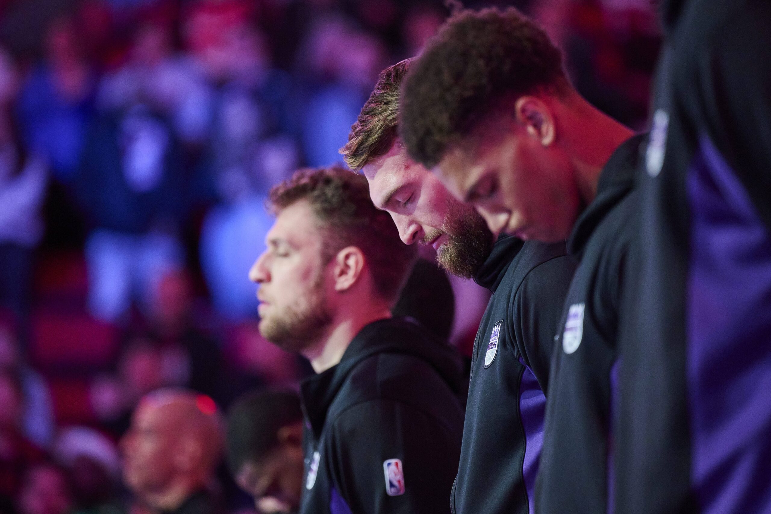 Sacramento Kings forward Domantas Sabonis (10) stands with teammates during the singing of the national anthem before a game against the Portland Trail Blazers at Moda Center.