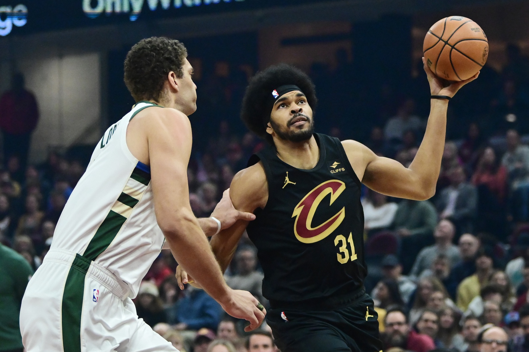 Dec 29, 2023; Cleveland, Ohio, USA; Cleveland Cavaliers center Jarrett Allen (31) drives to the basket against Milwaukee Bucks center Brook Lopez (11) during the first half at Rocket Mortgage FieldHouse. Mandatory Credit: Ken Blaze-USA TODAY Sports