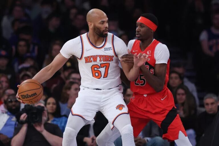 Apr 10, 2022; New York, New York, USA; New York Knicks center Taj Gibson (67) dribbles against Toronto Raptors forward Chris Boucher (25) during the first half at Madison Square Garden. Mandatory Credit: Vincent Carchietta-USA TODAY Sports