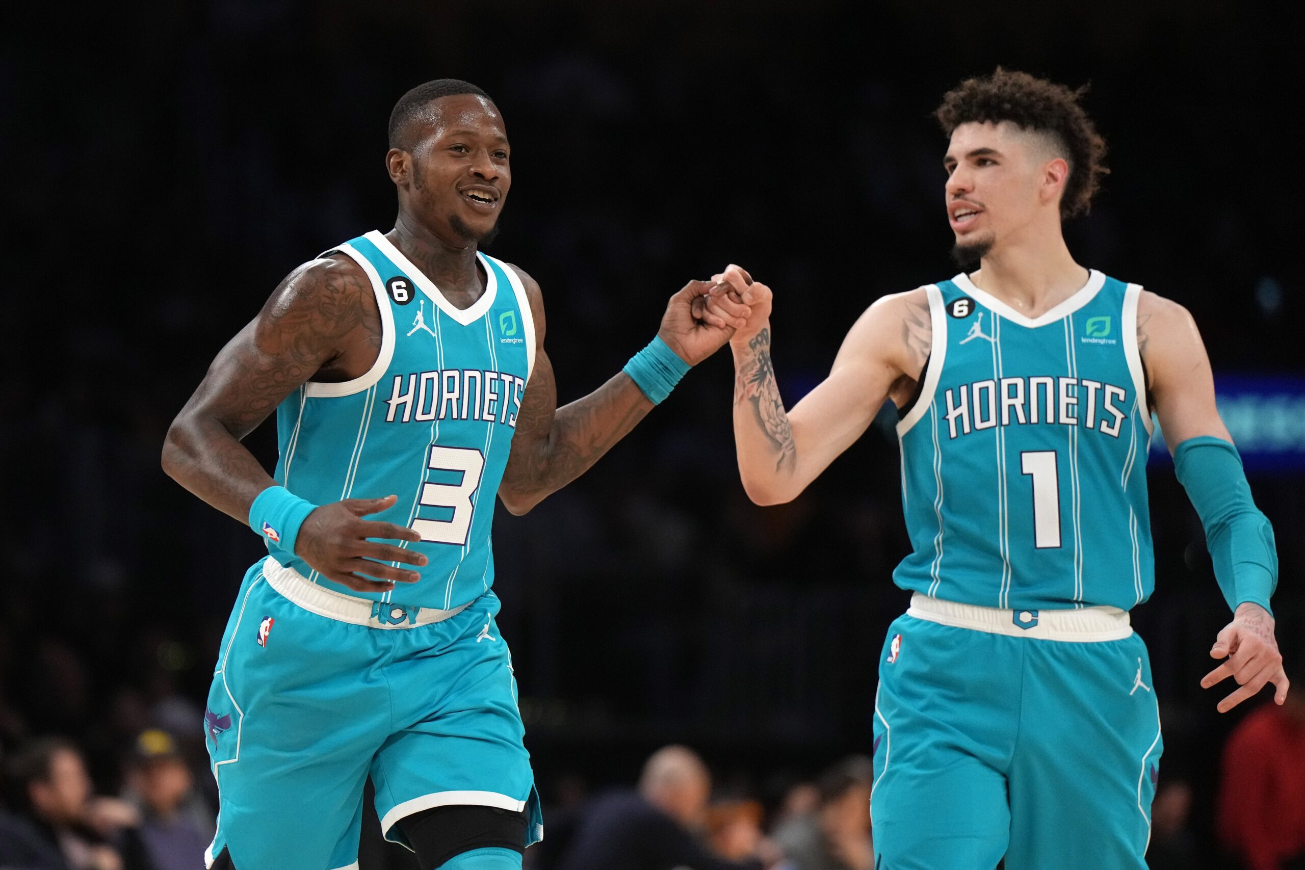 Dec 23, 2022; Los Angeles, California, USA; Charlotte Hornets guard Terry Rozier (3) celebrates with guard LaMelo Ball (1) after a three-point basket in the second half against the Los Angeles Lakers at Crypto.com Arena. The Hornets defeated the Lakers 134-130. Mandatory Credit: Kirby Lee-USA TODAY Sports