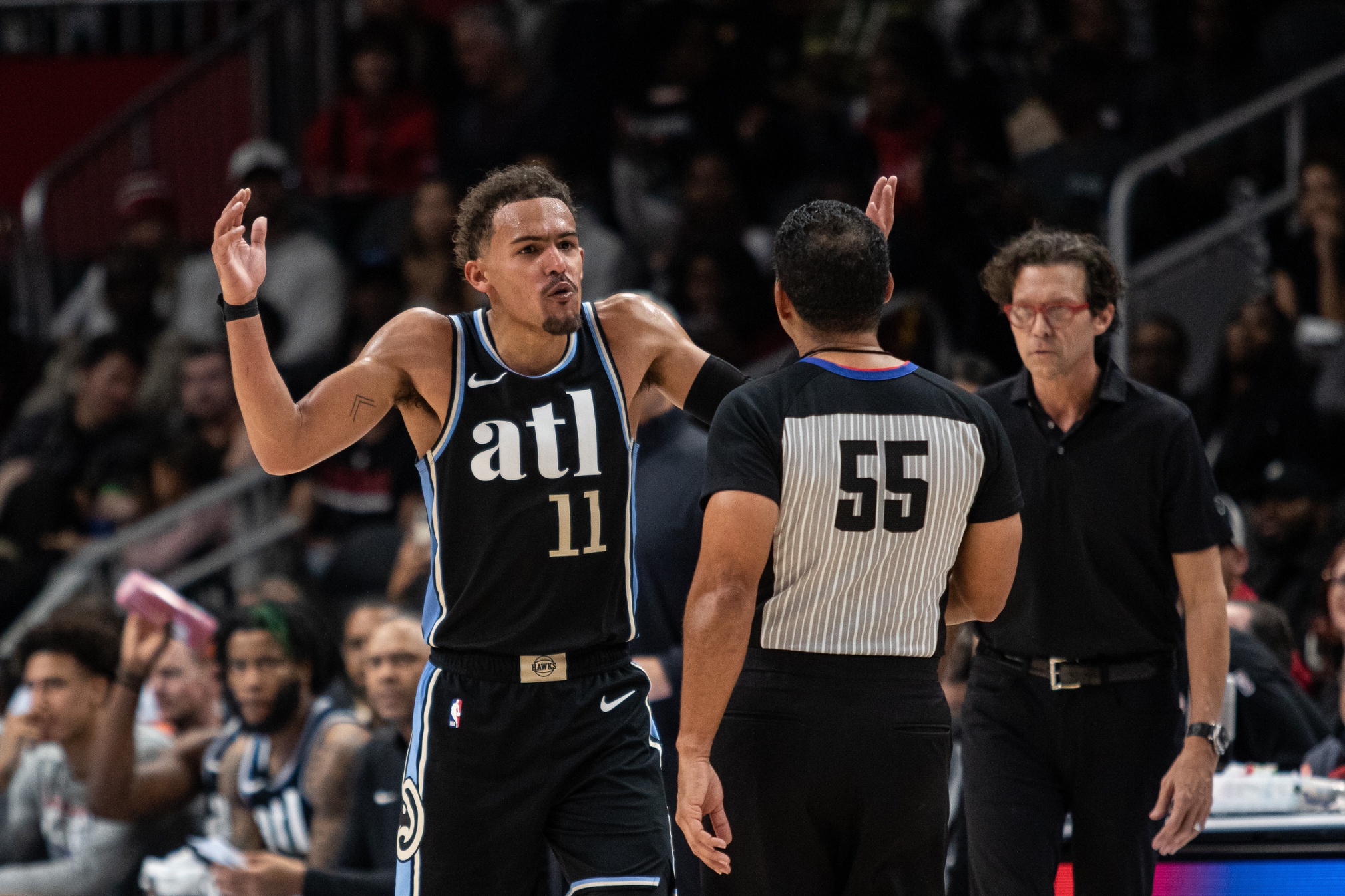 Atlanta Hawks guard Trae Young (11) argues with the ref during the forth quarter against Miami Heat at State Farm Arena.