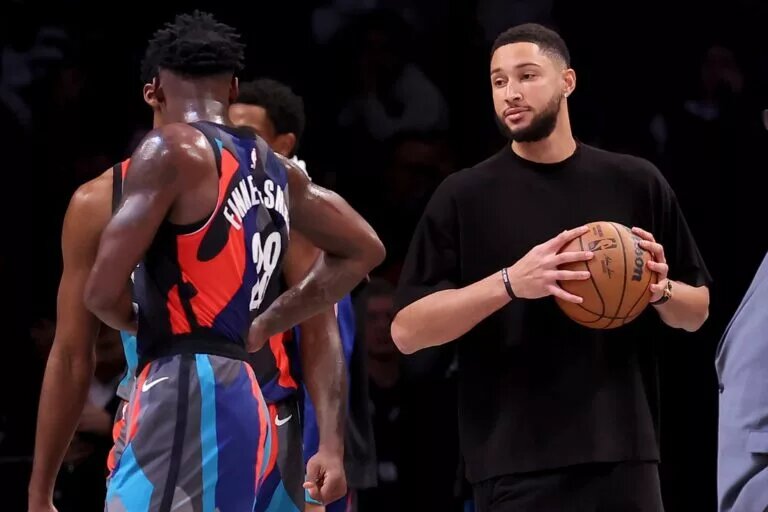 Nov 30, 2023; Brooklyn, New York, USA; Brooklyn Nets injured guard Ben Simmons (10) holds a basketball on the court during a time out during the third quarter against the Charlotte Hornets at Barclays Center. Mandatory Credit: Brad Penner-USA TODAY Sports