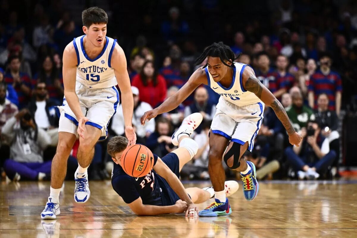 Dec 9, 2023; Philadelphia, Pennsylvania, USA; Kentucky Wildcats guard Reed Sheppard (15) and guard Rob Dillingham (0) chase a loose ball against the Penn Quakers in the second half at Wells Fargo Center. Mandatory Credit: Kyle Ross-USA TODAY Sports