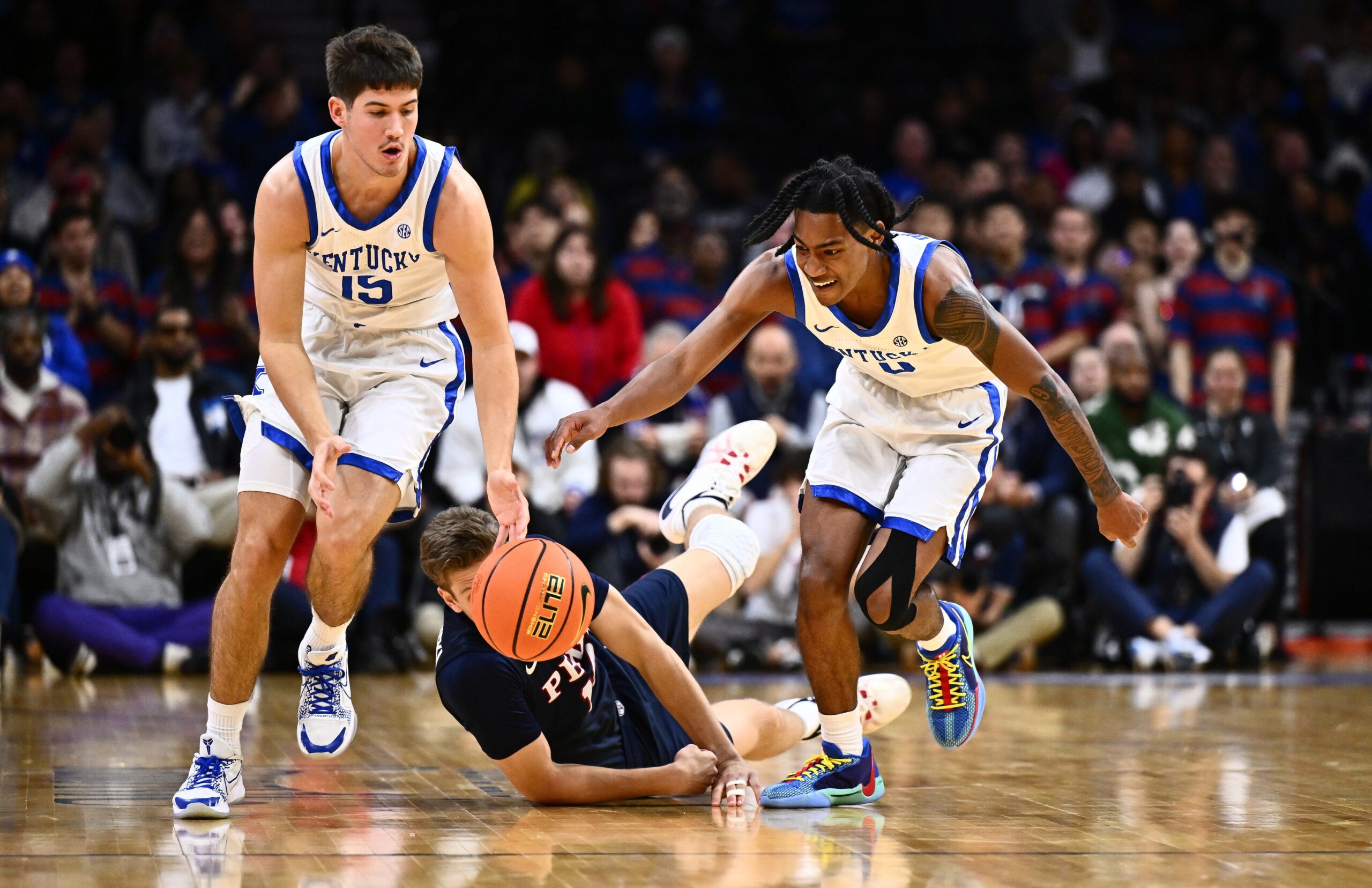 Dec 9, 2023; Philadelphia, Pennsylvania, USA; Kentucky Wildcats guard Reed Sheppard (15) and guard Rob Dillingham (0) chase a loose ball against the Penn Quakers in the second half at Wells Fargo Center. Mandatory Credit: Kyle Ross-USA TODAY Sports