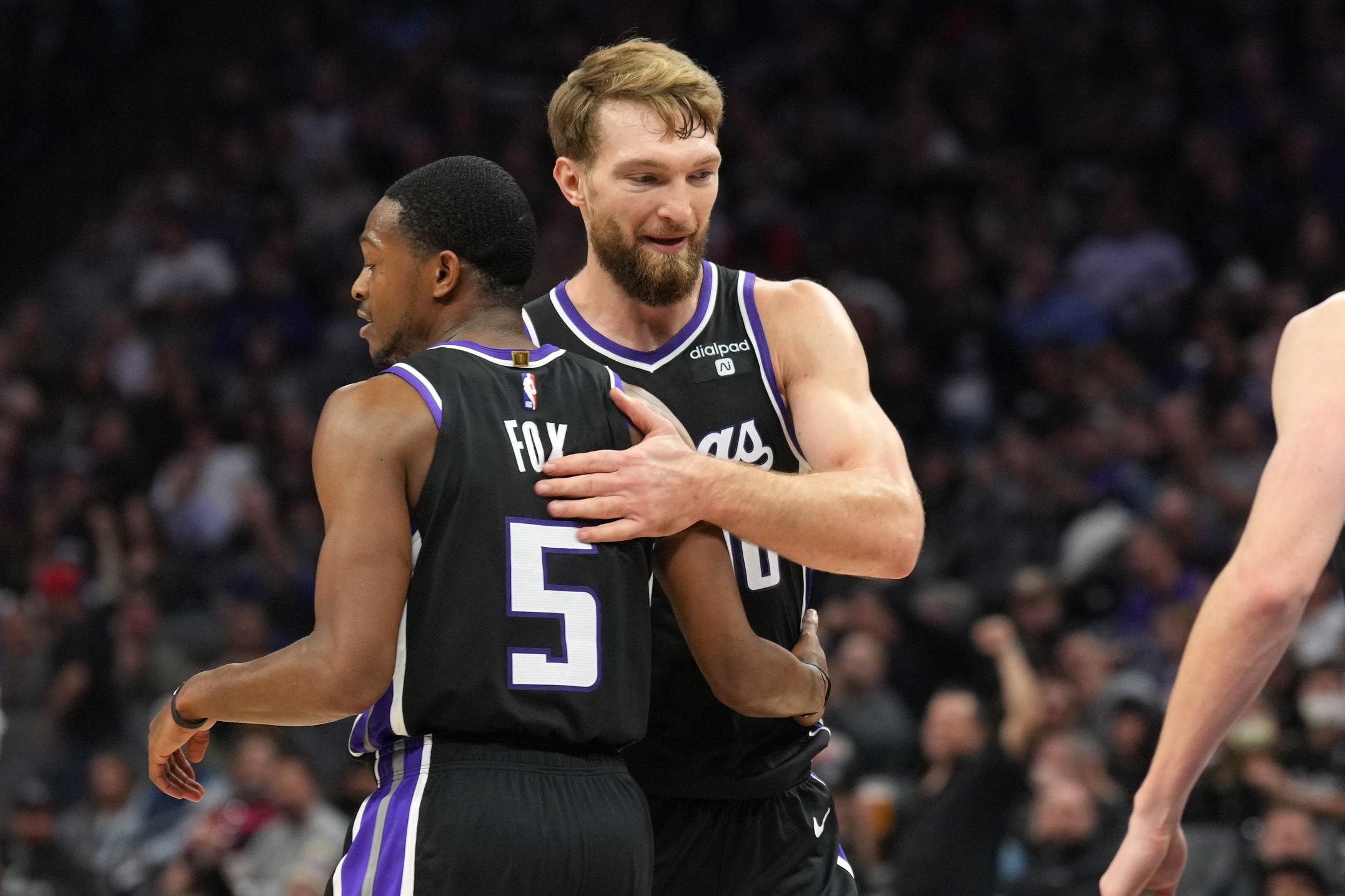 Sacramento Kings guard De'Aaron Fox (5) is congratulated by forward Domantas Sabonis (10) after a basket against the Oklahoma City Thunder during the second quarter at Golden 1 Center.