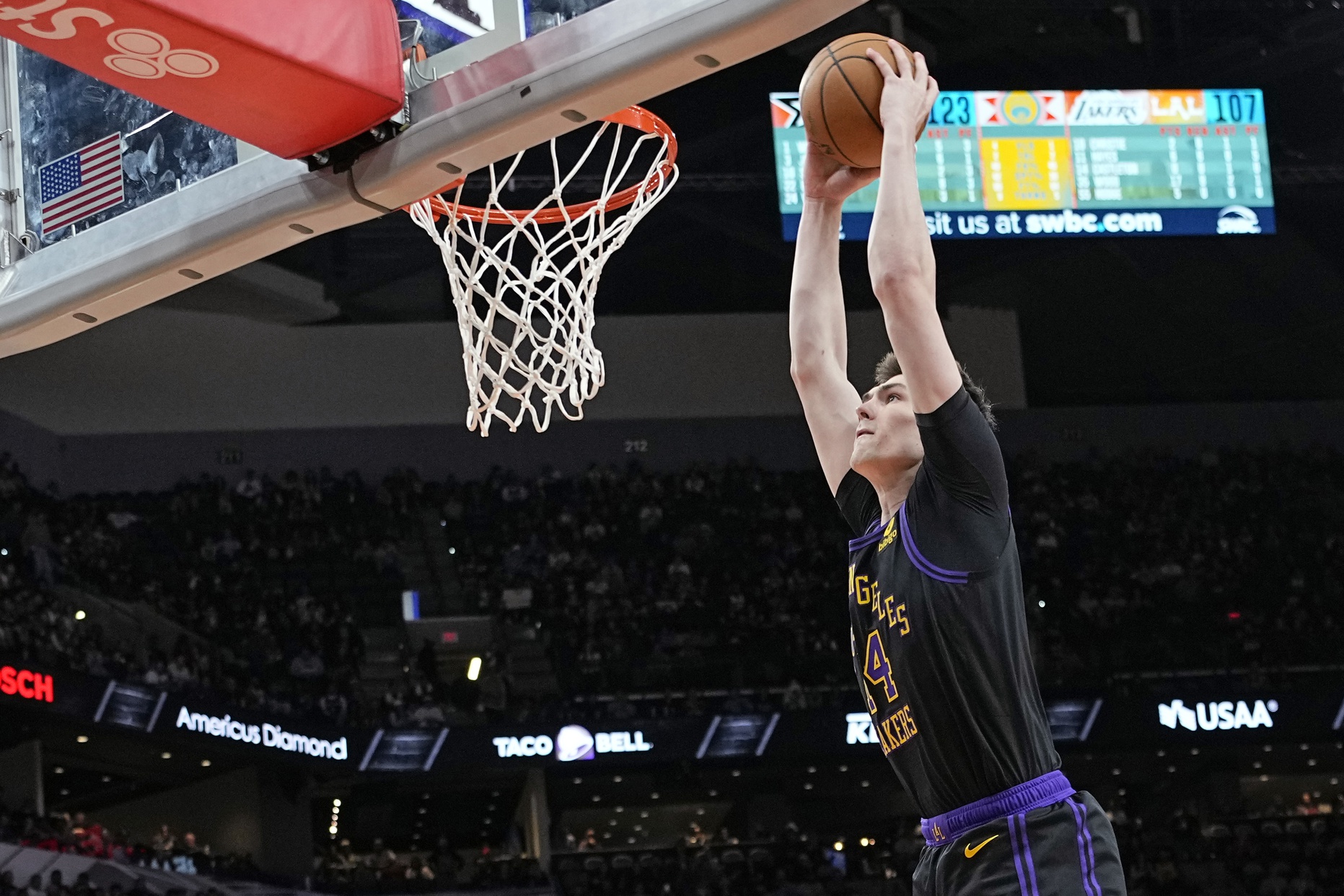 Dec 15, 2023; San Antonio, Texas, USA; Los Angeles Lakers center Colin Castleton (14) goes up for a dunk during the second half against the San Antonio Spurs at Frost Bank Center. Mandatory Credit: Scott Wachter-USA TODAY Sports