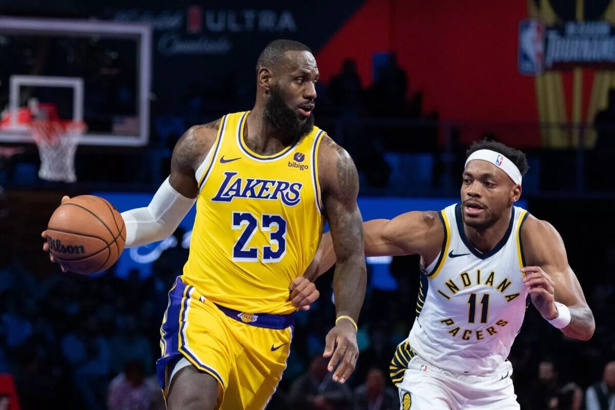 December 9, 2023; Las Vegas, Nevada, USA; Los Angeles Lakers forward LeBron James (23) dribbles the basketball against Indiana Pacers forward Bruce Brown (11) during the third quarter of the in-season tournament championship at T-Mobile Arena. Mandatory Credit: Kyle Terada-USA TODAY Sports