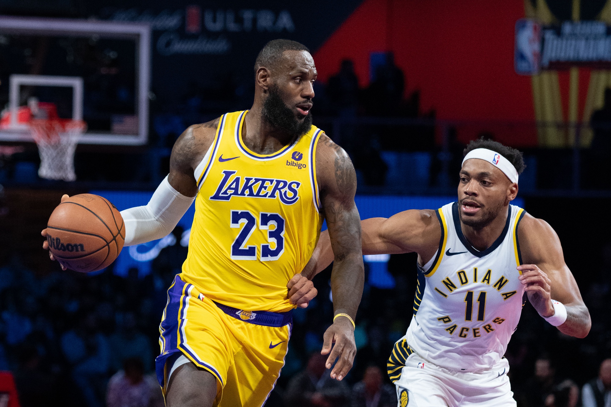 December 9, 2023; Las Vegas, Nevada, USA; Los Angeles Lakers forward LeBron James (23) dribbles the basketball against Indiana Pacers forward Bruce Brown (11) during the third quarter of the in-season tournament championship at T-Mobile Arena. Mandatory Credit: Kyle Terada-USA TODAY Sports