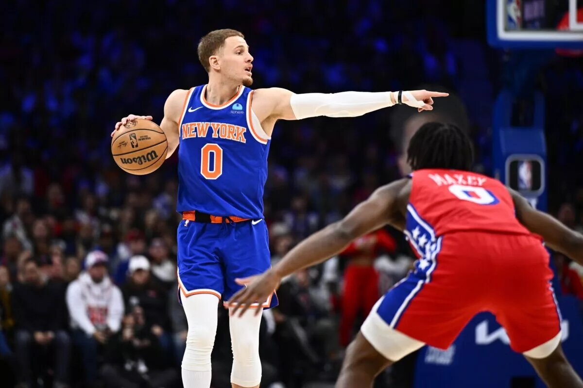 New York Knicks guard Donte DiVincenzo (0) gestures against the Philadelphia 76ers in the first quarter at Wells Fargo Center.