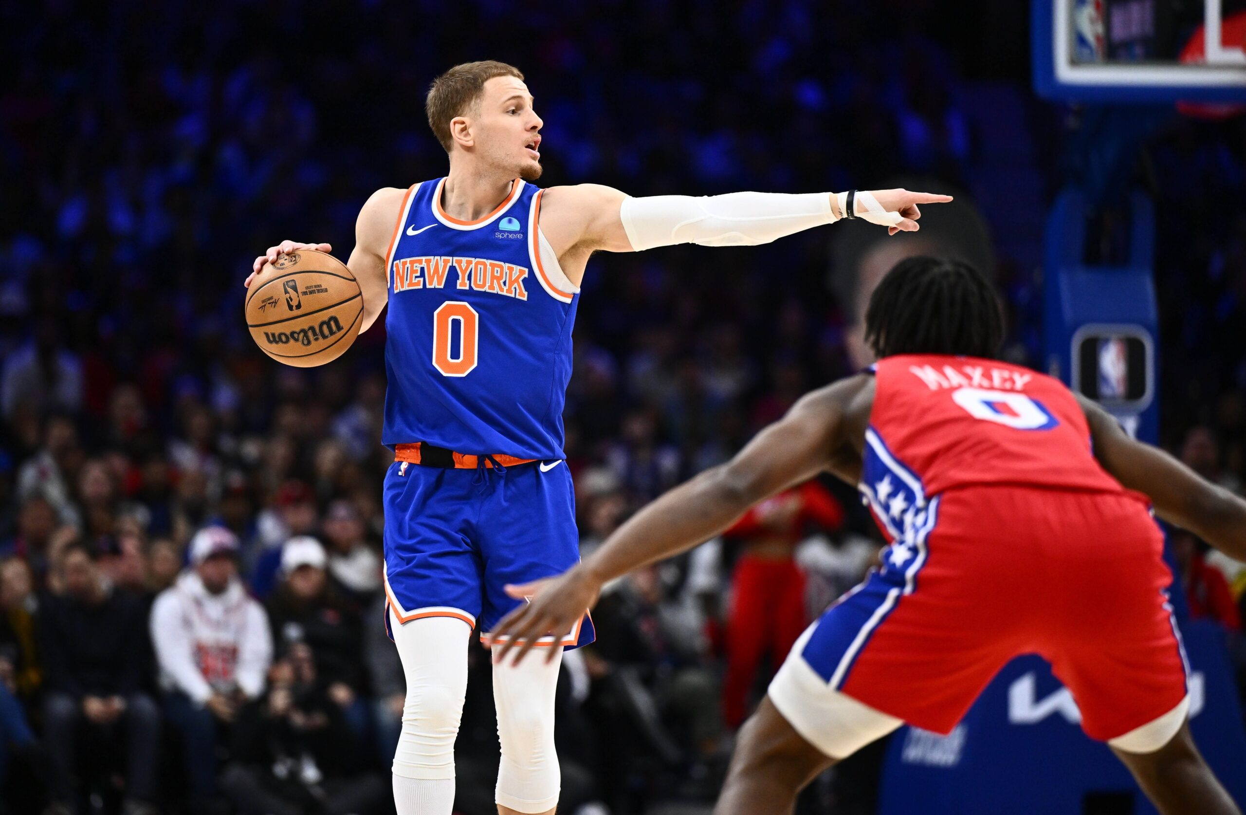 New York Knicks guard Donte DiVincenzo (0) gestures against the Philadelphia 76ers in the first quarter at Wells Fargo Center.