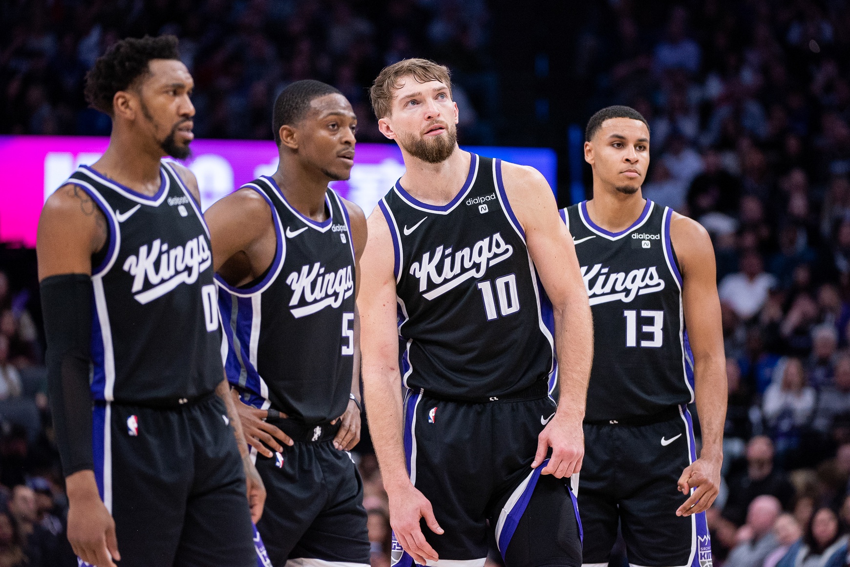 Sacramento Kings guard Malik Monk (0) and guard De'Aaron Fox (5) and forward Domantas Sabonis (10) and forward Keegan Murray (13) look on during a free throw during the fourth quarter against the Toronto Raptors at Golden 1 Center.