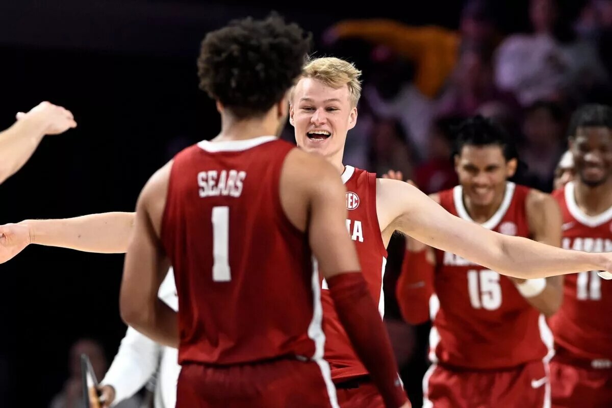 Alabama forward Max Scharnowski greets guard Mark Sears (1) after a timeout during the second half of an NCAA college basketball game against Vanderbilt Saturday, Jan. 6, 2024, in Nashville, Tenn. Alabama won 78-75.