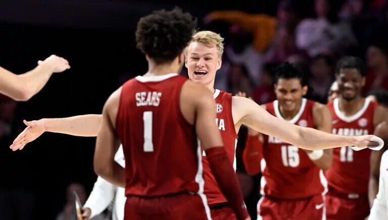 Alabama forward Max Scharnowski greets guard Mark Sears (1) after a timeout during the second half of an NCAA college basketball game against Vanderbilt Saturday, Jan. 6, 2024, in Nashville, Tenn. Alabama won 78-75.