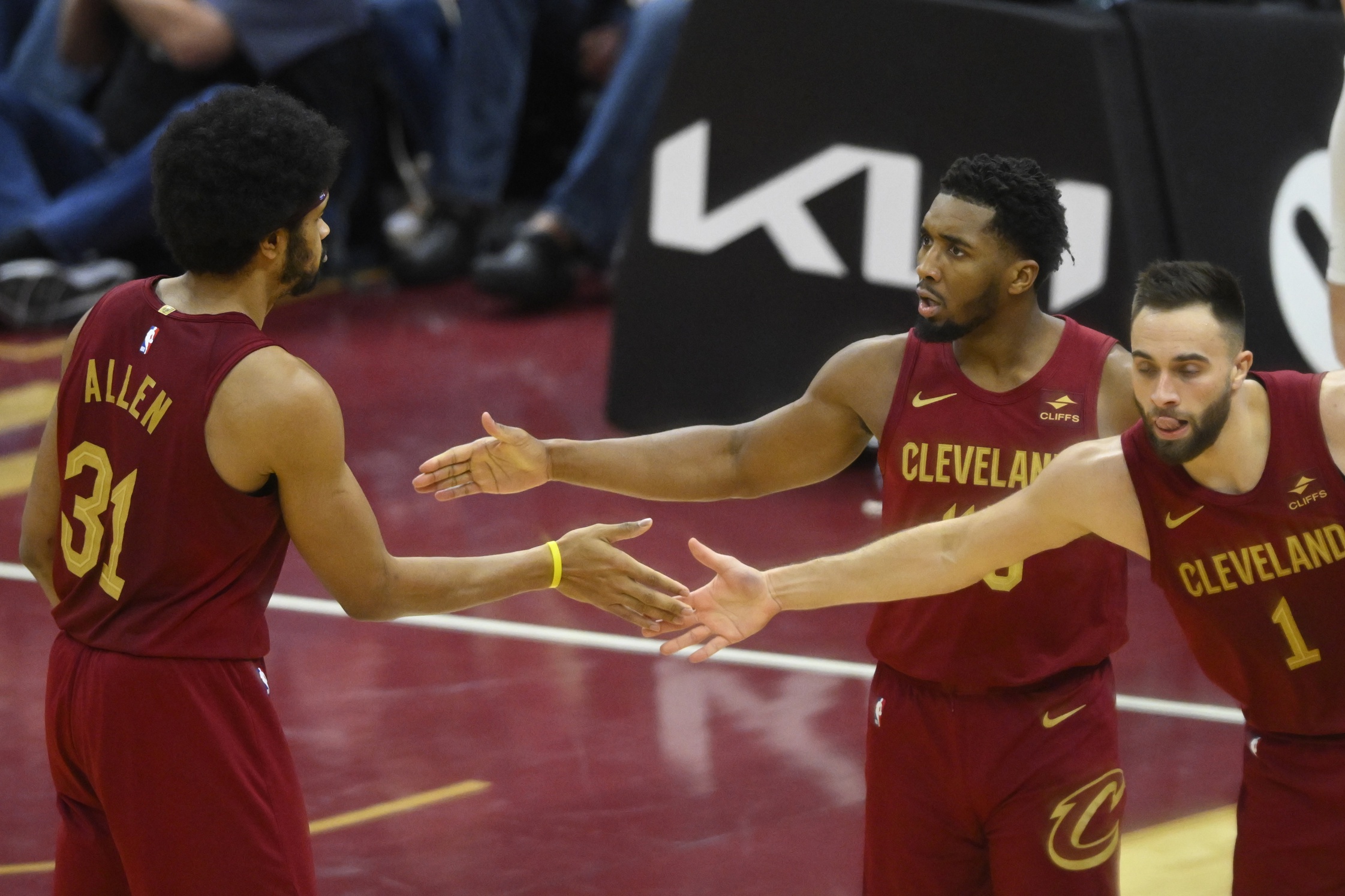 Cleveland Cavaliers center Jarrett Allen (31), guard Donovan Mitchell (45) and guard Max Strus (1) celebrate in the fourth quarter against the San Antonio Spurs at Rocket Mortgage FieldHouse.