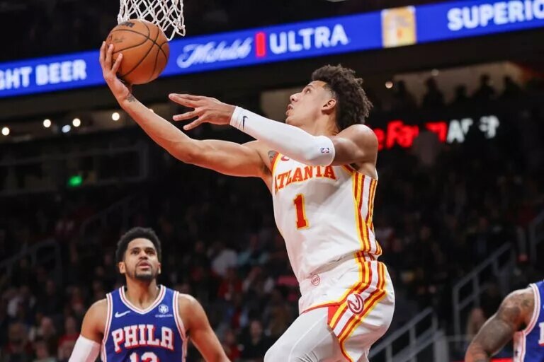 Atlanta Hawks forward Jalen Johnson (1) shoots against the Philadelphia 76ers in overtime at State Farm Arena.