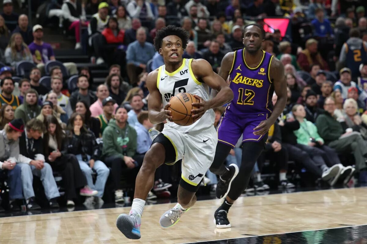 Jan 13, 2024; Salt Lake City, Utah, USA; Utah Jazz guard Collin Sexton (2) dribbles past Los Angeles Lakers forward Taurean Prince (12) during the fourth quarter at Delta Center. Mandatory Credit: Rob Gray-USA TODAY Sports