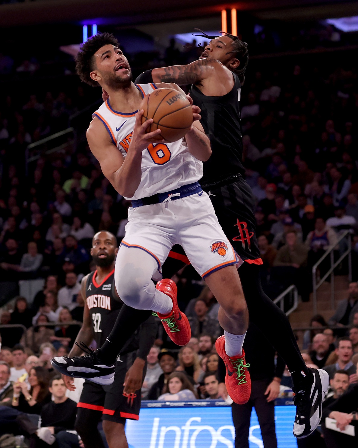 New York Knicks guard Quentin Grimes (6) is fouled by Houston Rockets forward Cam Whitmore (7) as he drives to the basket during the second quarter at Madison Square Garden.