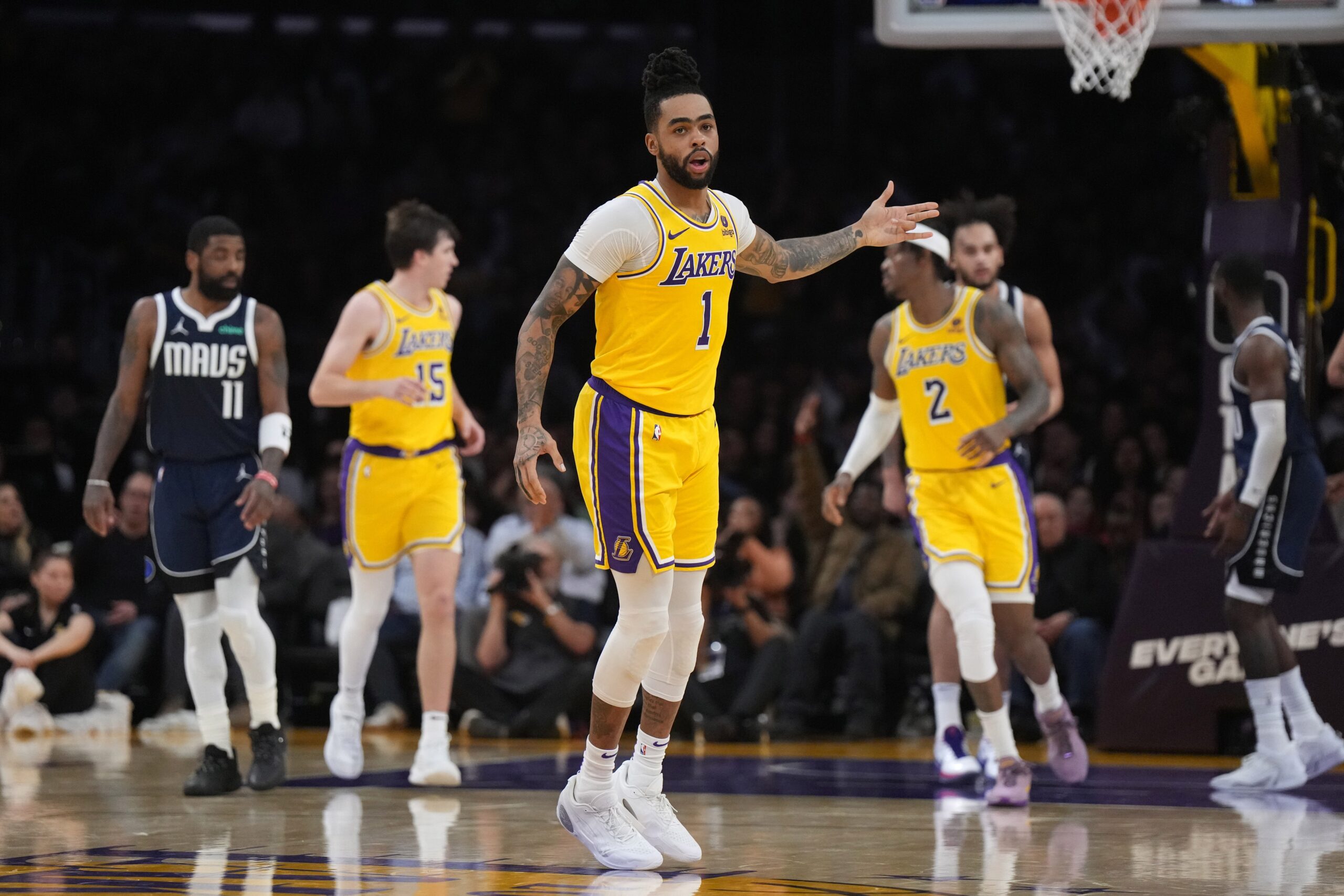 Los Angeles Lakers guard D'Angelo Russell (1) gestures after a three-point basket against the Dallas Mavericks in the first half at Crypto.com Arena.