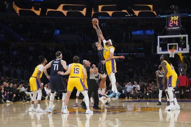 A jump ball between Dallas Mavericks center Dereck Lively II (2) and Los Angeles Lakers forward Anthony Davis (3) in the first half at Crypto.com Arena.