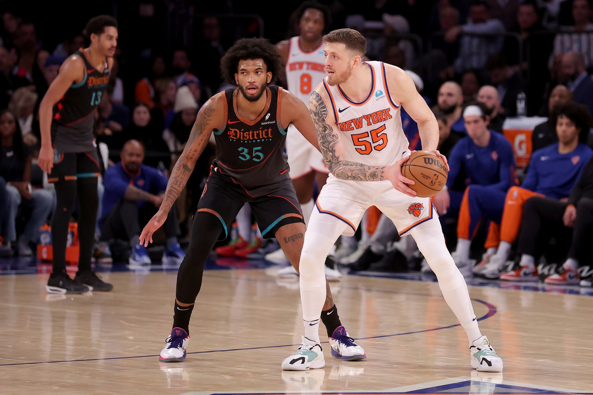New York Knicks center Isaiah Hartenstein (55) controls the ball against Washington Wizards forward Marvin Bagley III (35) during the fourth quarter at Madison Square Garden.
