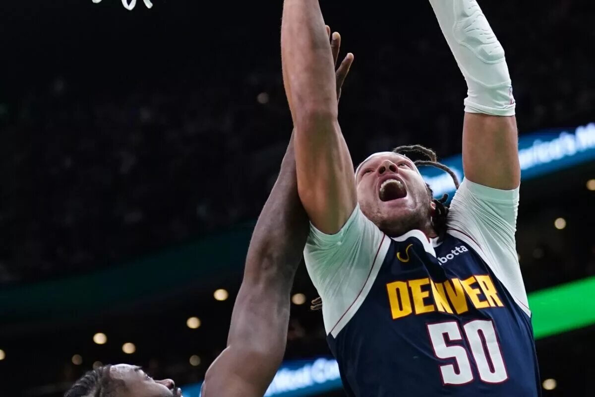 Denver Nuggets forward Aaron Gordon (50) shoots against Boston Celtics guard Jaylen Brown (7) in the first quarter at TD Garden.