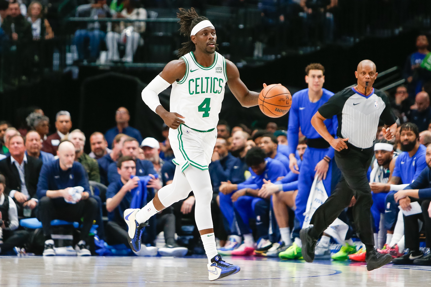 Jan 22, 2024; Dallas, Texas, USA; Boston Celtics guard Jrue Holiday (4) brings the ball up the court during the first quarter against the Dallas Mavericks at American Airlines Center. Mandatory Credit: Andrew Dieb-USA TODAY Sports