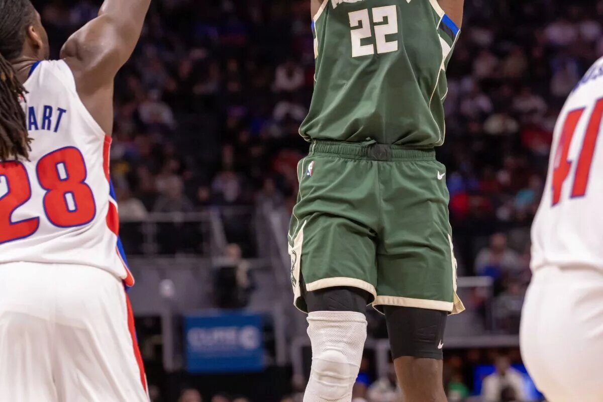 Milwaukee Bucks forward Khris Middleton (22) shoots the ball against the Detroit Pistons during the second half at Little Caesars Arena.