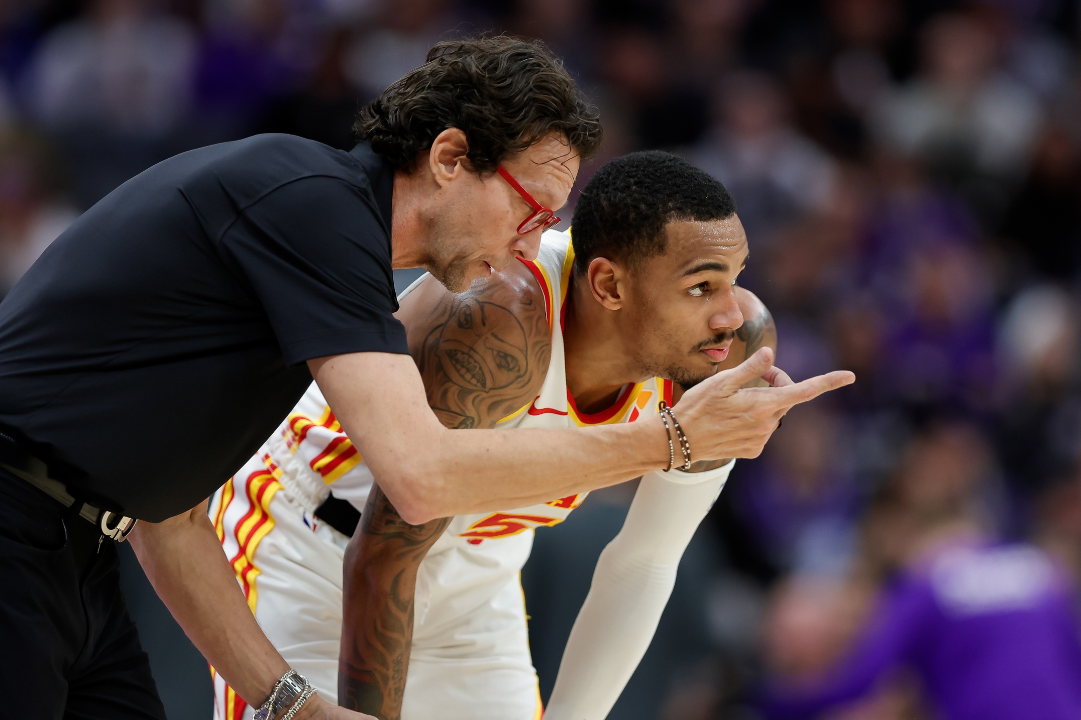 Atlanta Hawks guard Dejounte Murray (5) is instructed by head coach Quin Snyder during the third quarter against the Sacramento Kings at Golden 1 Center.