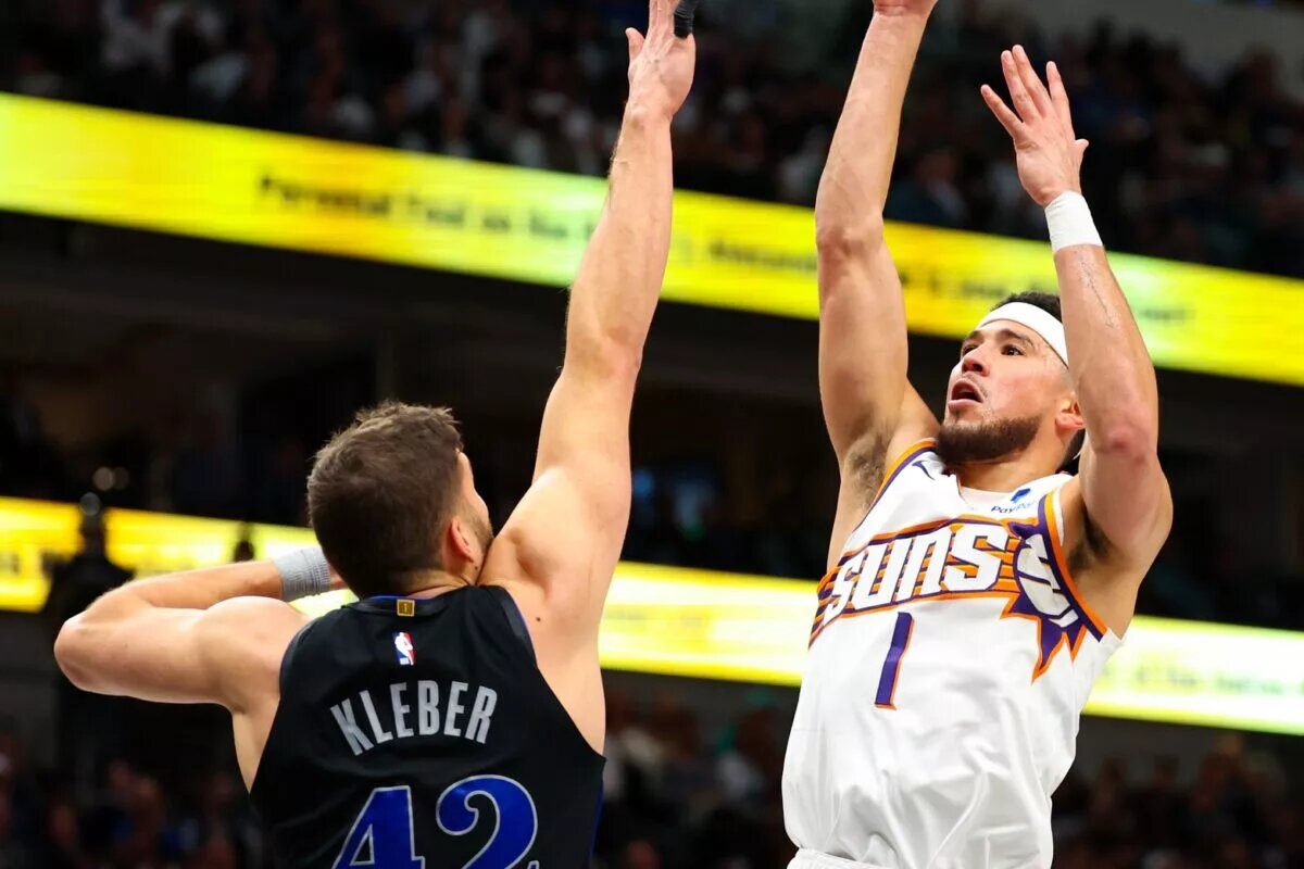 Phoenix Suns guard Devin Booker (1) shoots over Dallas Mavericks forward Maxi Kleber (42) during the third quarter at American Airlines Center.
