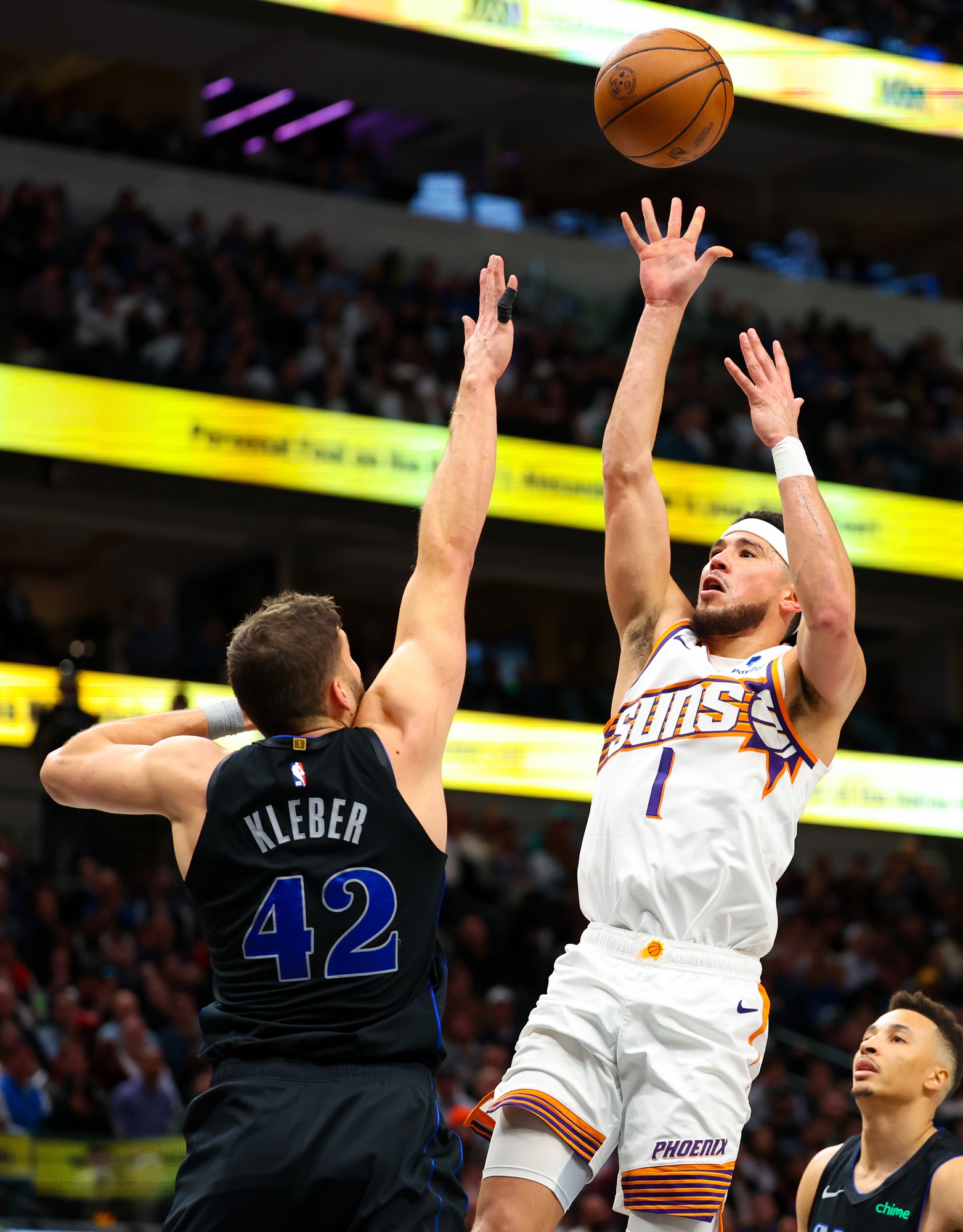 Phoenix Suns guard Devin Booker (1) shoots over Dallas Mavericks forward Maxi Kleber (42) during the third quarter at American Airlines Center.
