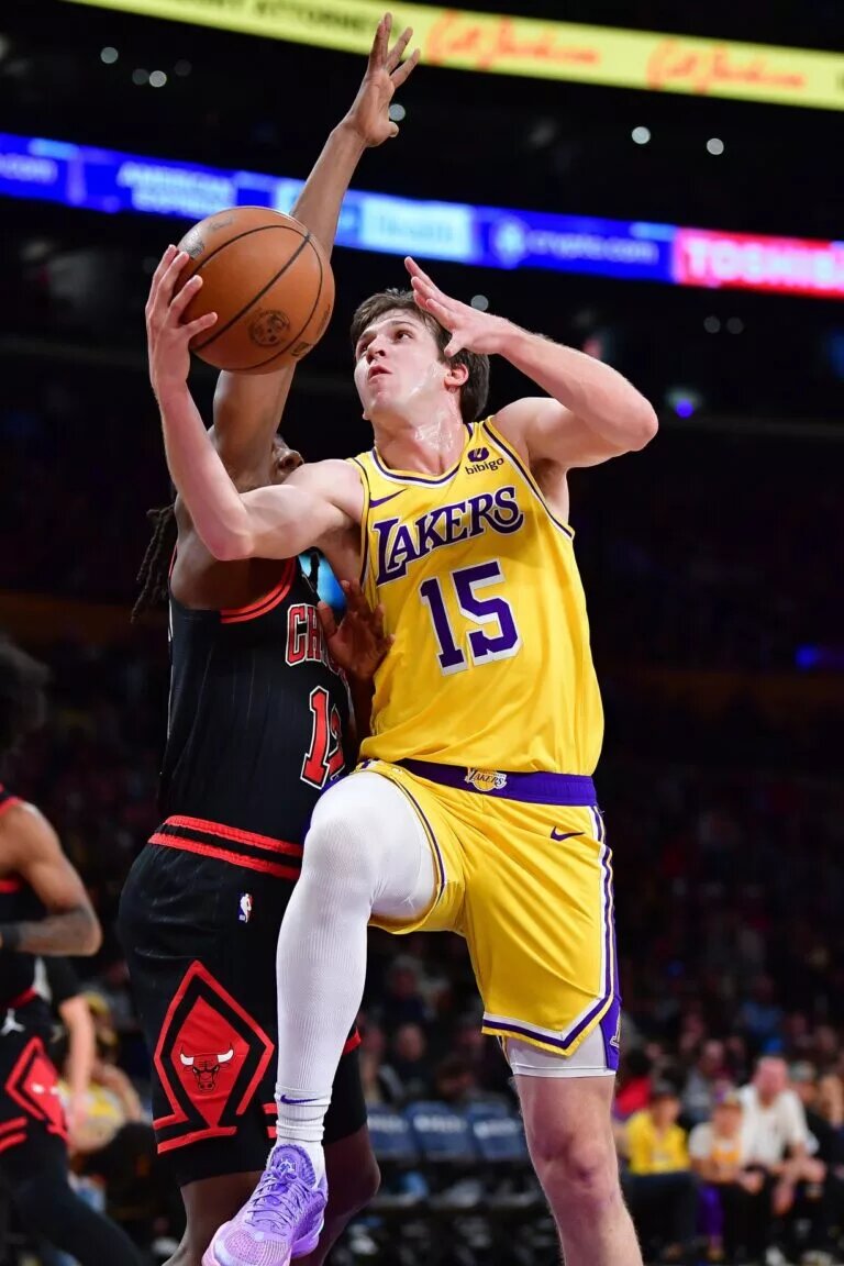 Los Angeles Lakers guard Austin Reaves (15) moves to the basket agianst Chicago Bulls guard Ayo Dosunmu (12) during the first half at Crypto.com Arena.