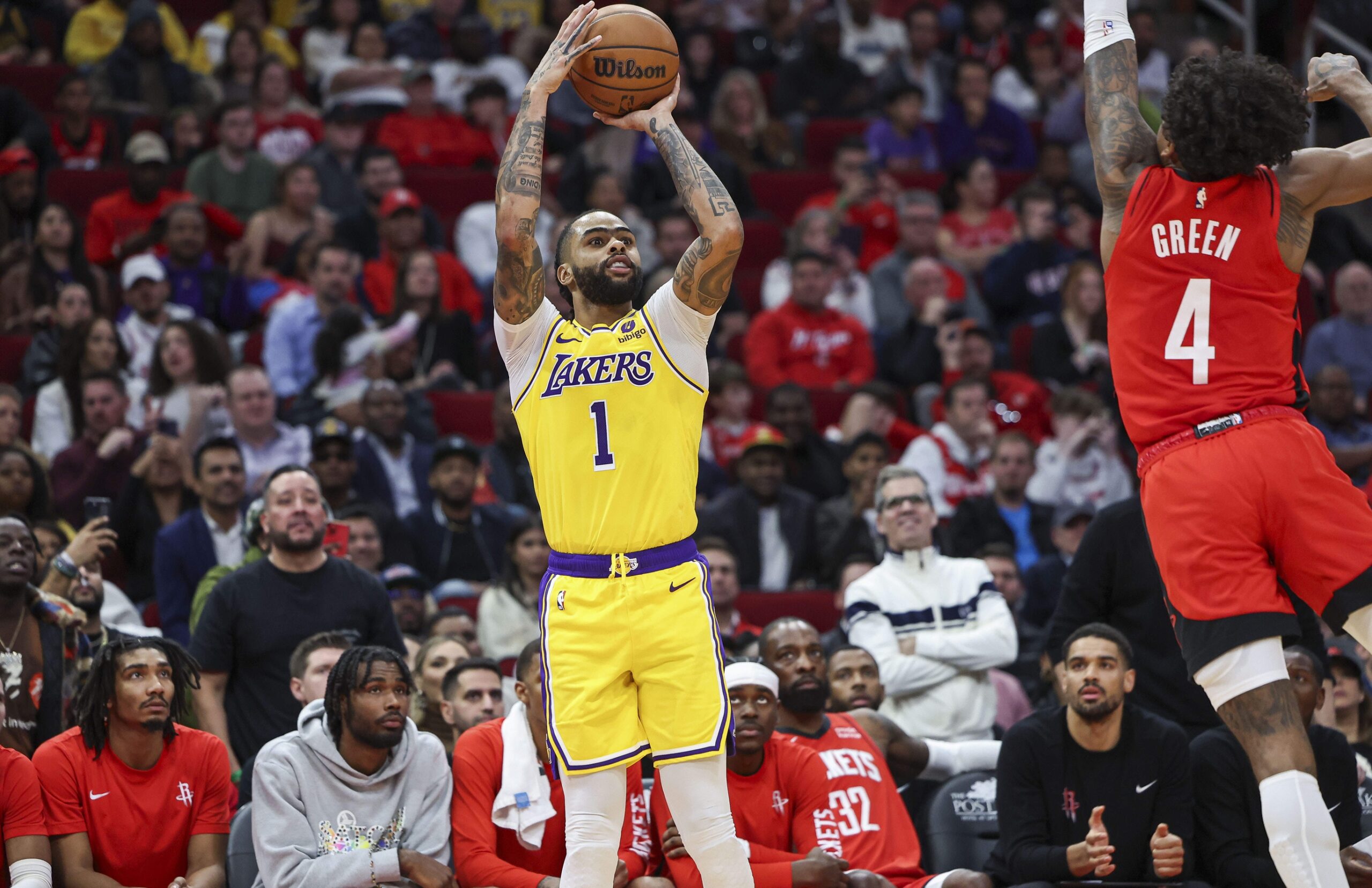 Los Angeles Lakers guard D'Angelo Russell (1) shoots the ball as Houston Rockets guard Jalen Green (4) defends during the fourth quarter at Toyota Center.