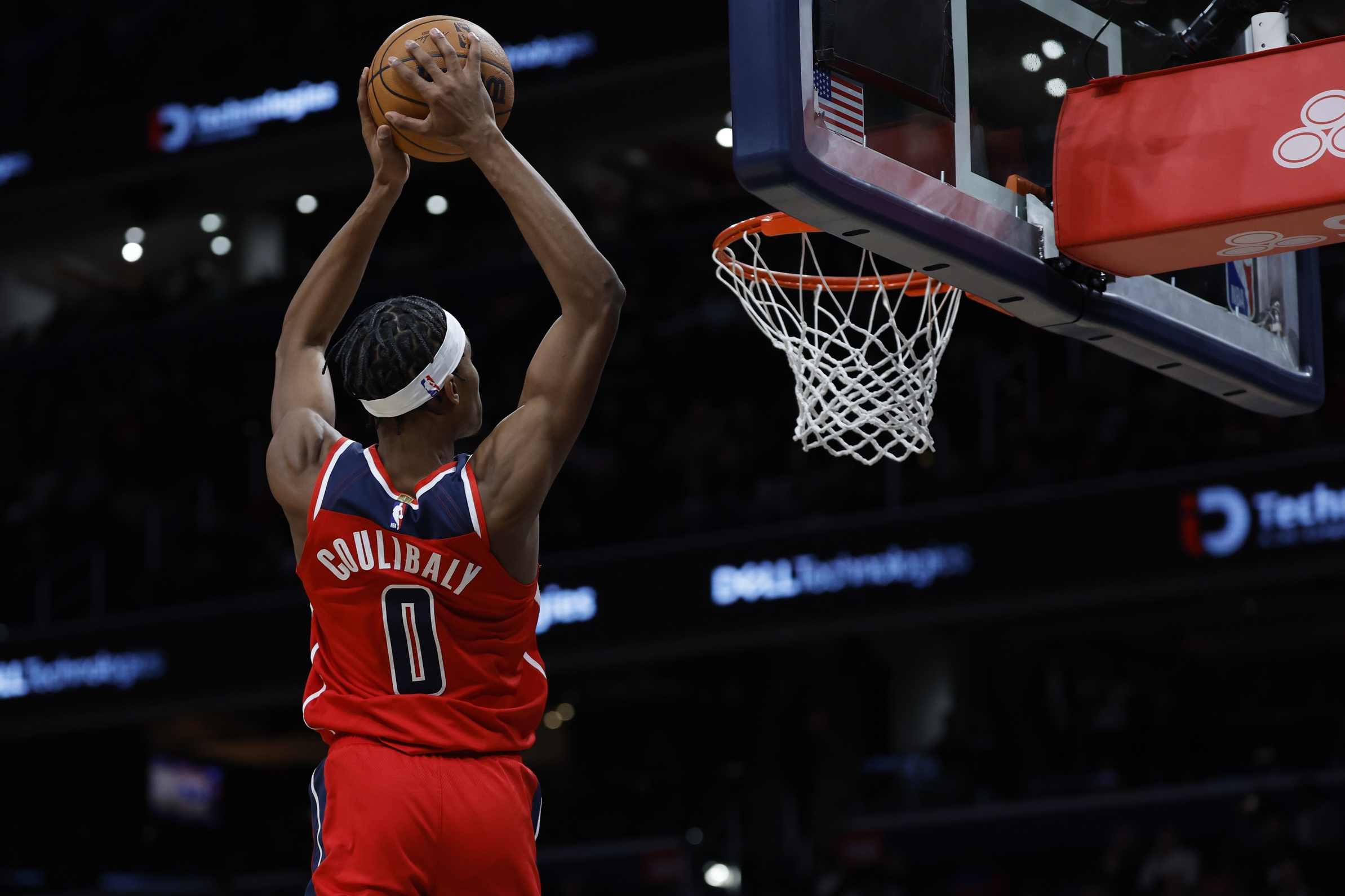 Washington Wizards guard Bilal Coulibaly (0) dunks the ball against the LA Clippers in the first half at Capital One Arena.