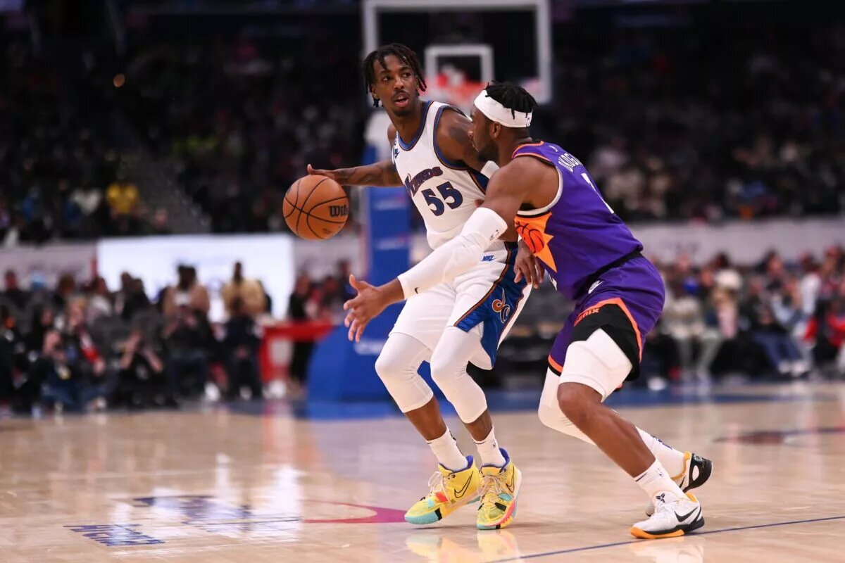 Dec 28, 2022; Washington, District of Columbia, USA; Washington Wizards guard Delon Wright (55) dribbles as Phoenix Suns forward Josh Okogie (2) defends during the first half at Capital One Arena. Mandatory Credit: Tommy Gilligan-USA TODAY Sports