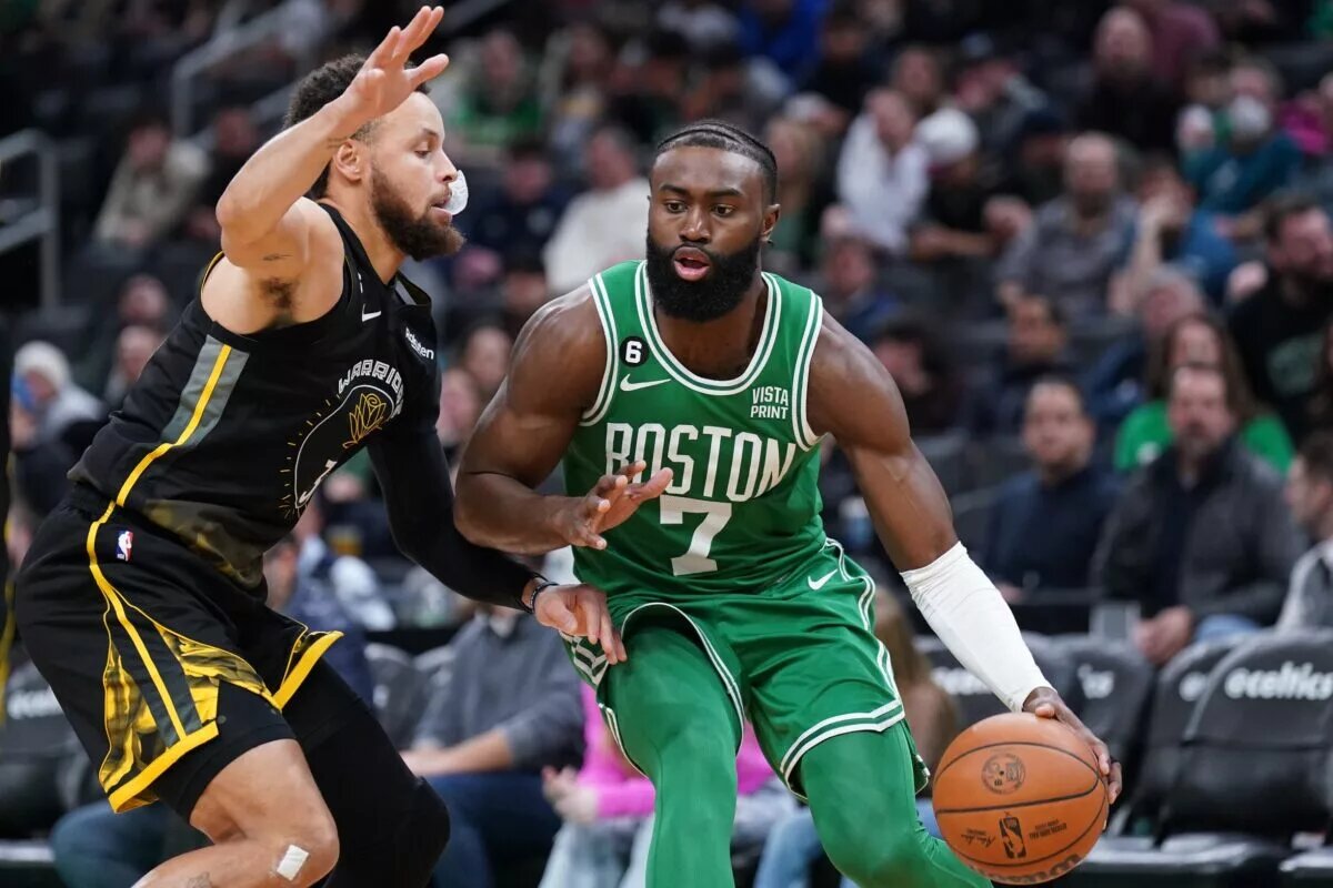 Jan 19, 2023; Boston, Massachusetts, USA; Boston Celtics guard Jaylen Brown (7) drives the ball against Golden State Warriors guard Stephen Curry (30) in the second half at TD Garden. Mandatory Credit: David Butler II-USA TODAY Sports