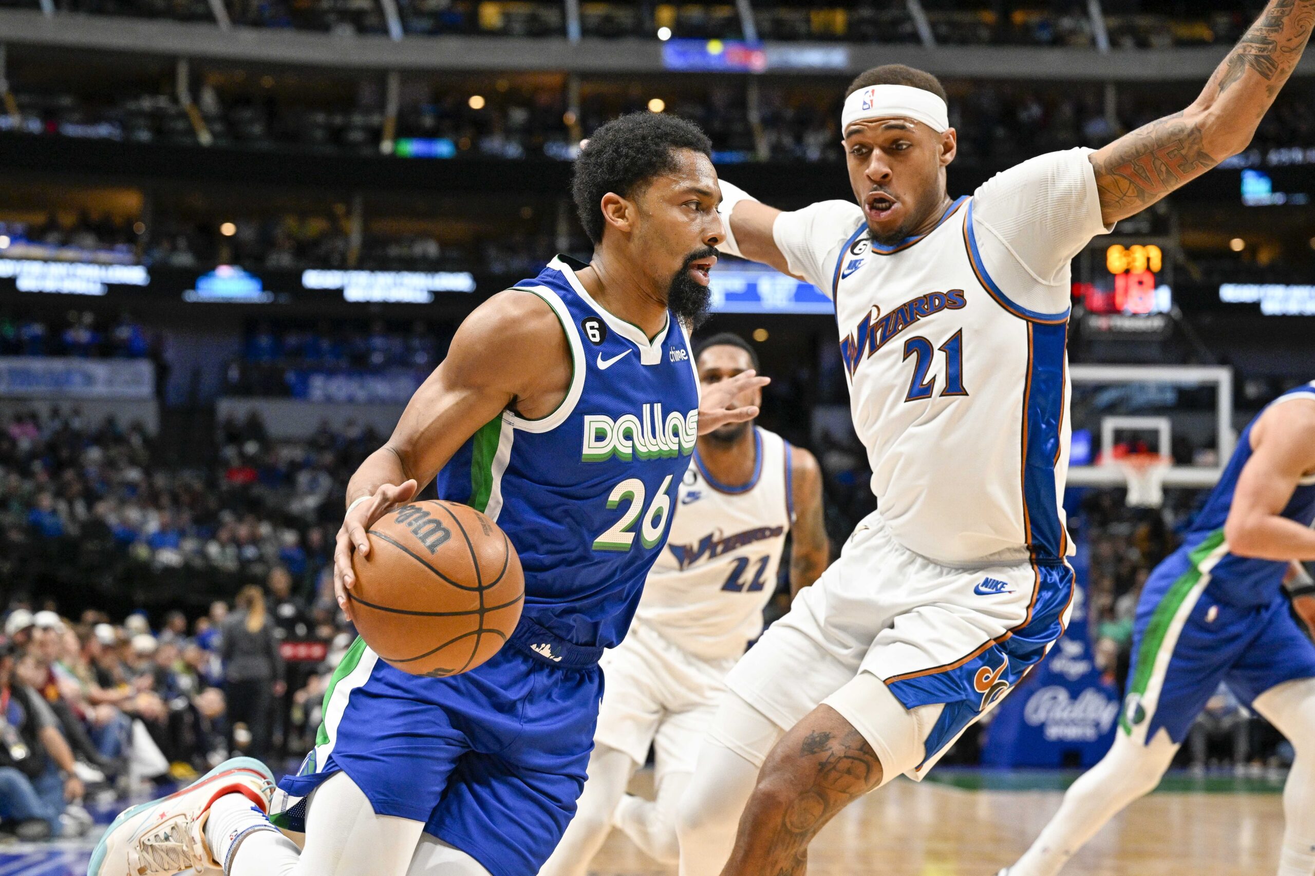 Jan 24, 2023; Dallas, Texas, USA; Dallas Mavericks guard Spencer Dinwiddie (26) drives to the basket past Washington Wizards center Daniel Gafford (21) during the first quarter at the American Airlines Center. Mandatory Credit: Jerome Miron-USA TODAY Sports