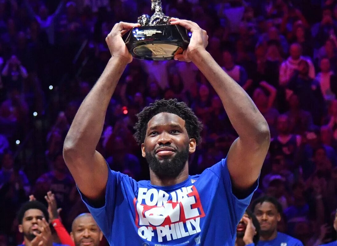 Philadelphia 76ers center Joel Embiid (21) with the MVP trophy before game three of the 2023 NBA playoff against the Boston Celtics at Wells Fargo Center.