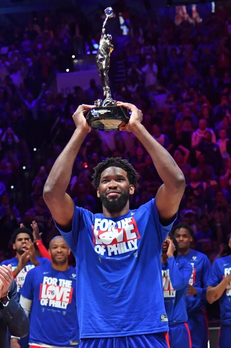 Philadelphia 76ers center Joel Embiid (21) with the MVP trophy before game three of the 2023 NBA playoff against the Boston Celtics at Wells Fargo Center.