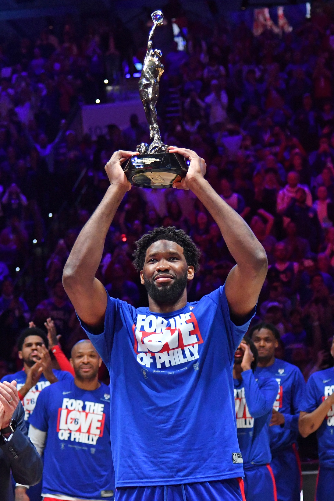 Philadelphia 76ers center Joel Embiid (21) with the MVP trophy before game three of the 2023 NBA playoff against the Boston Celtics at Wells Fargo Center.