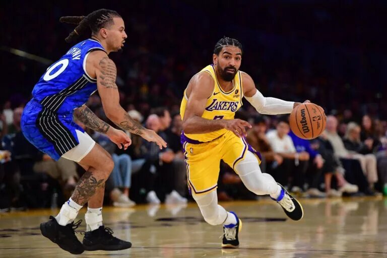 Los Angeles Lakers guard Gabe Vincent (7) moves to the basket against Orlando Magic guard Cole Anthony (50) during the second half at Crypto.com Arena.