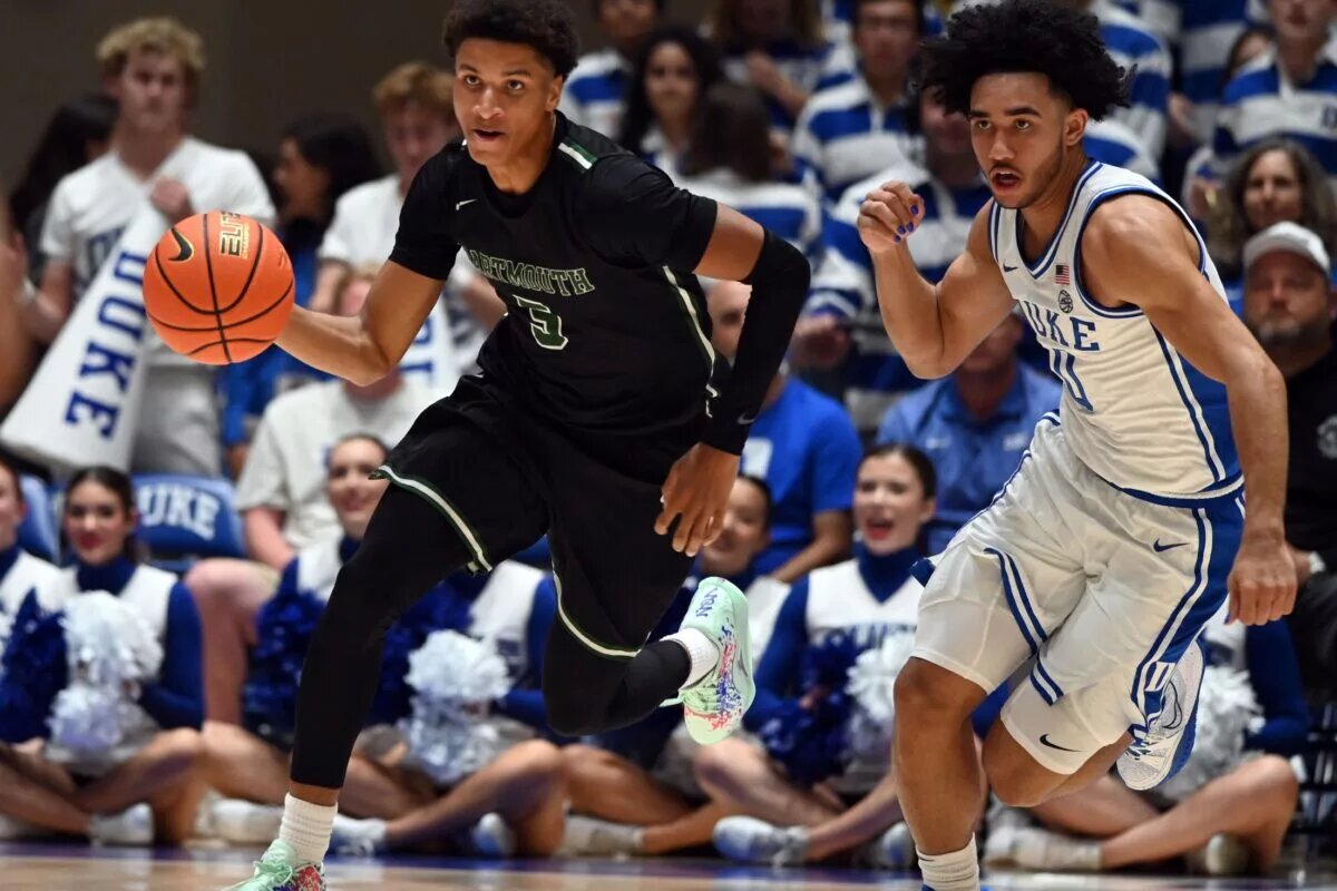 Nov 6, 2023; Durham, North Carolina, USA; Dartmouth Big Green guard Jaren Johnson (5) dribbles up courts as Duke Blue Devils guard Jared McCain (0) pursues during the first half at Cameron Indoor Stadium. Mandatory Credit: Rob Kinnan-USA TODAY Sports