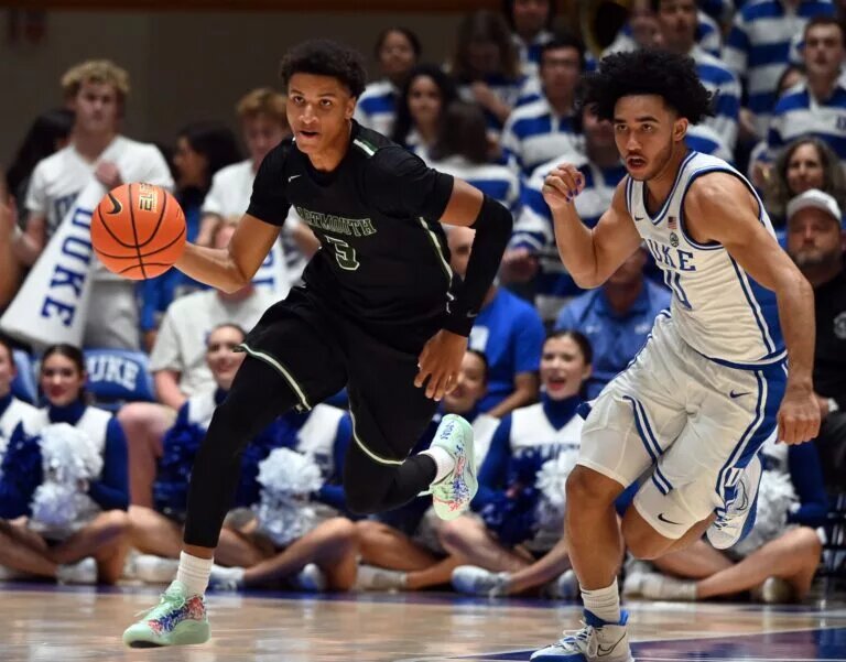 Nov 6, 2023; Durham, North Carolina, USA; Dartmouth Big Green guard Jaren Johnson (5) dribbles up courts as Duke Blue Devils guard Jared McCain (0) pursues during the first half at Cameron Indoor Stadium. Mandatory Credit: Rob Kinnan-USA TODAY Sports