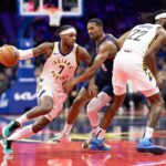 Nov 14, 2023; Philadelphia, Pennsylvania, USA; Indiana Pacers guard Buddy Hield (7) dribbles past Philadelphia 76ers guard De'Anthony Melton (8) during the third quarter at Wells Fargo Center. Mandatory Credit: Bill Streicher-USA TODAY Sports