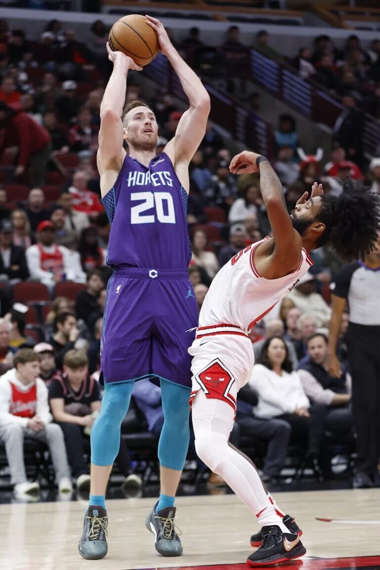 Charlotte Hornets forward Gordon Hayward (20) shoots against Chicago Bulls guard Coby White (0) during the first half at United Center.