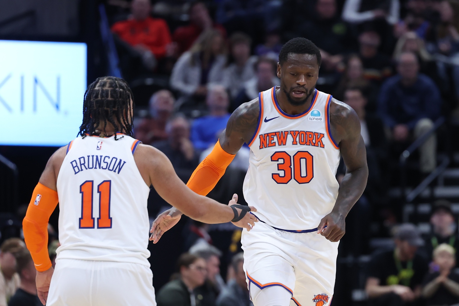 New York Knicks forward Julius Randle (30) and guard Jalen Brunson (11) react to a play against the Utah Jazz during the third quarter at Delta Center.
