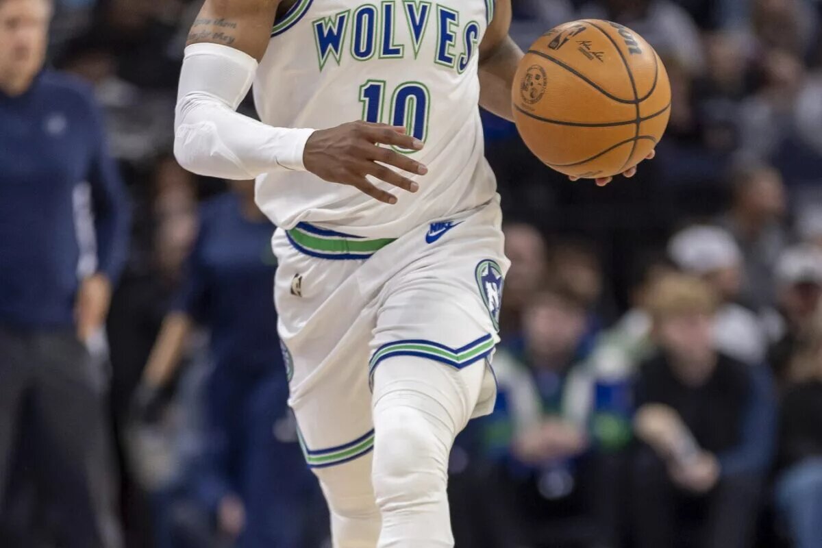 Minnesota Timberwolves guard Mike Conley (10) dribbles the ball down the court against the New Orleans Pelicans in the first half at Target Center.