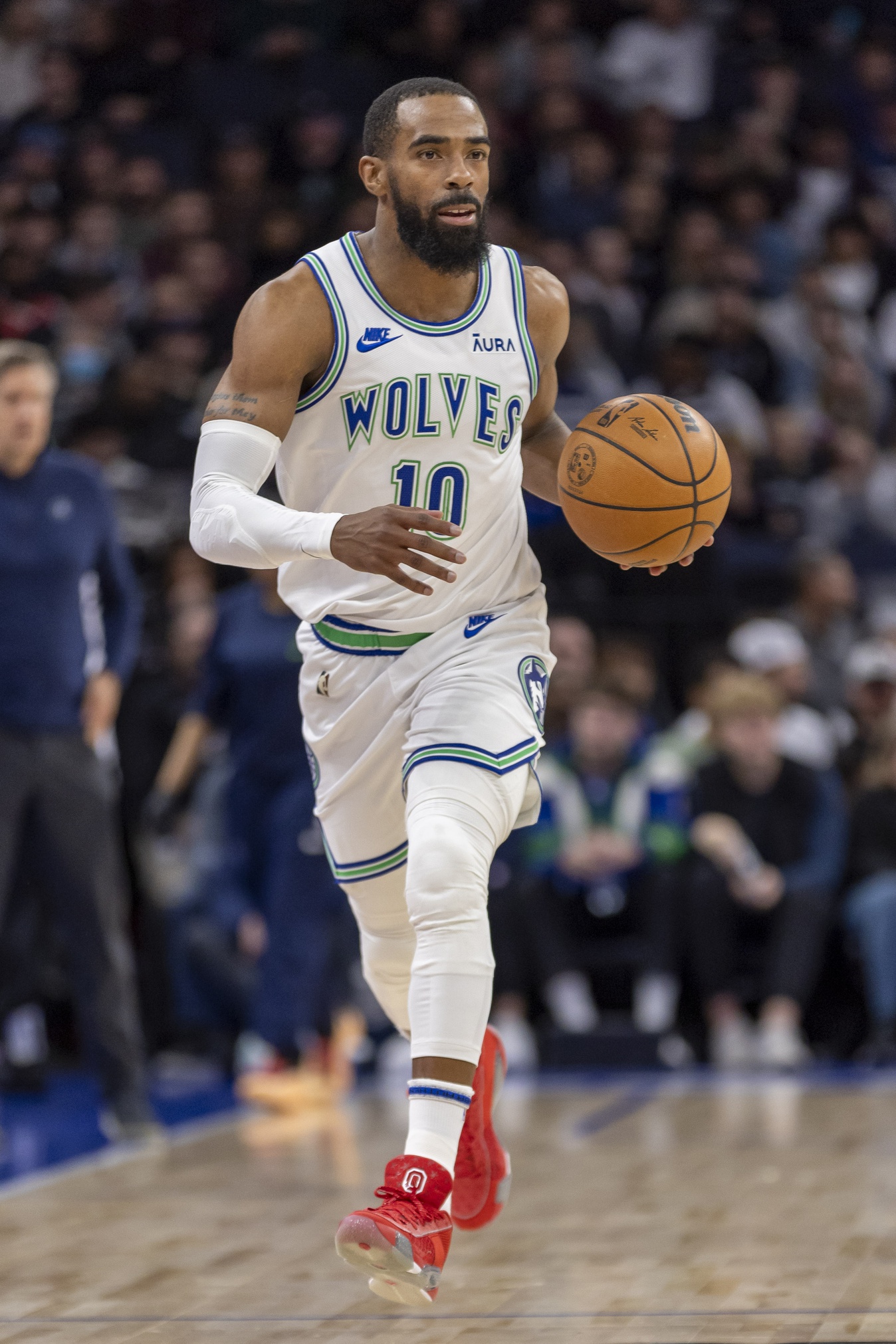Minnesota Timberwolves guard Mike Conley (10) dribbles the ball down the court against the New Orleans Pelicans in the first half at Target Center.