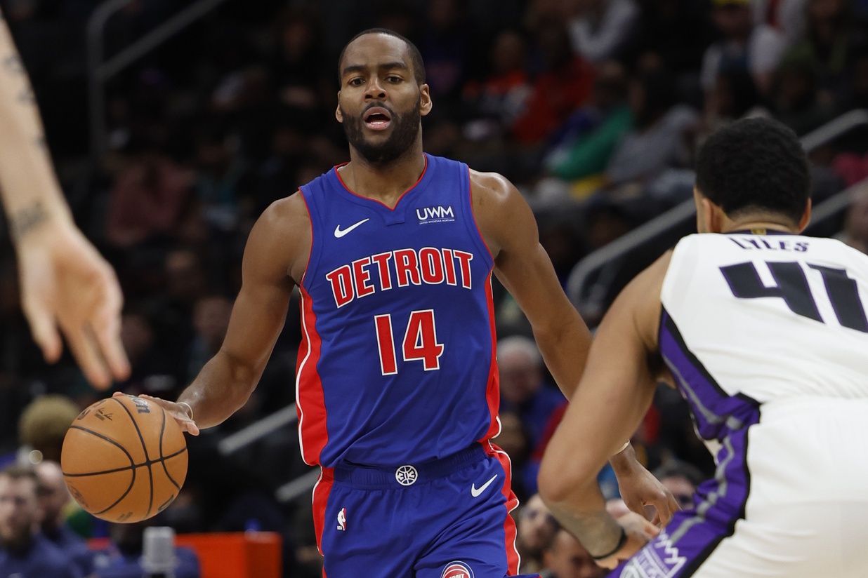 Detroit Pistons guard Alec Burks (14) dribbles defended by Sacramento Kings forward Trey Lyles (41) in the second half at Little Caesars Arena.
