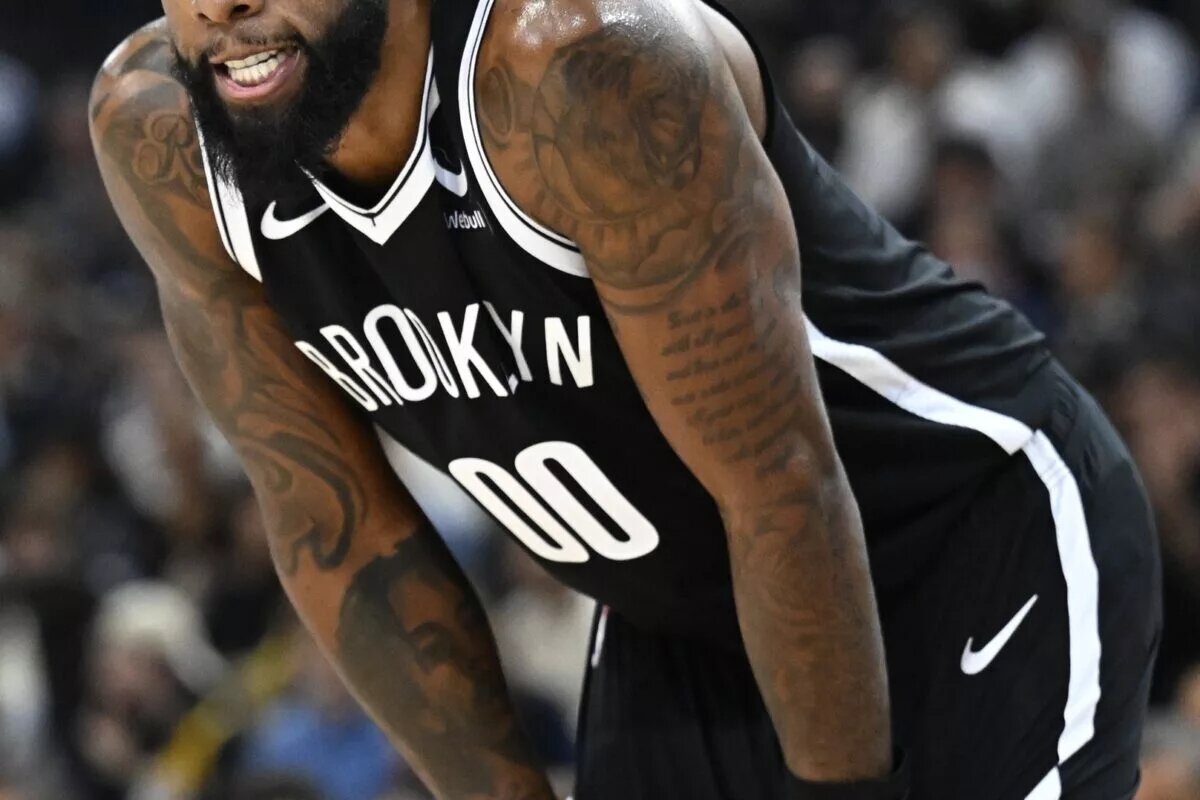 Brooklyn Nets forward Royce O'Neale (00) reacts against the Cleveland Cavaliers in the NBA Paris Game at AccorHotels Arena.